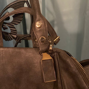 Nicole Miller leather brown purse.     901